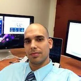 Portrait of Chris Nowlan at his desk